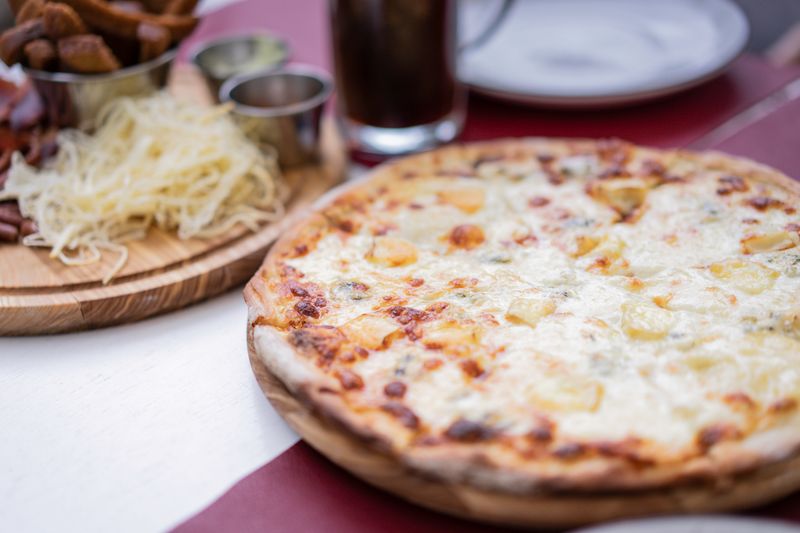 Mod Pizza extra cheese topping add-on for pizza