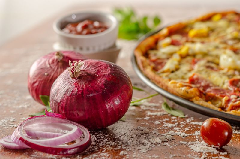 mod pizza being crafted fresh at Mod Pizza kitchen